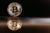 a bit coin sitting on top of a table
