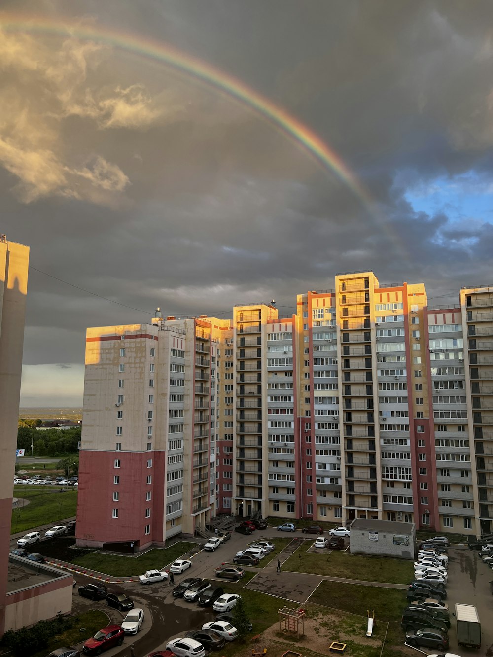 a rainbow in the sky over a city