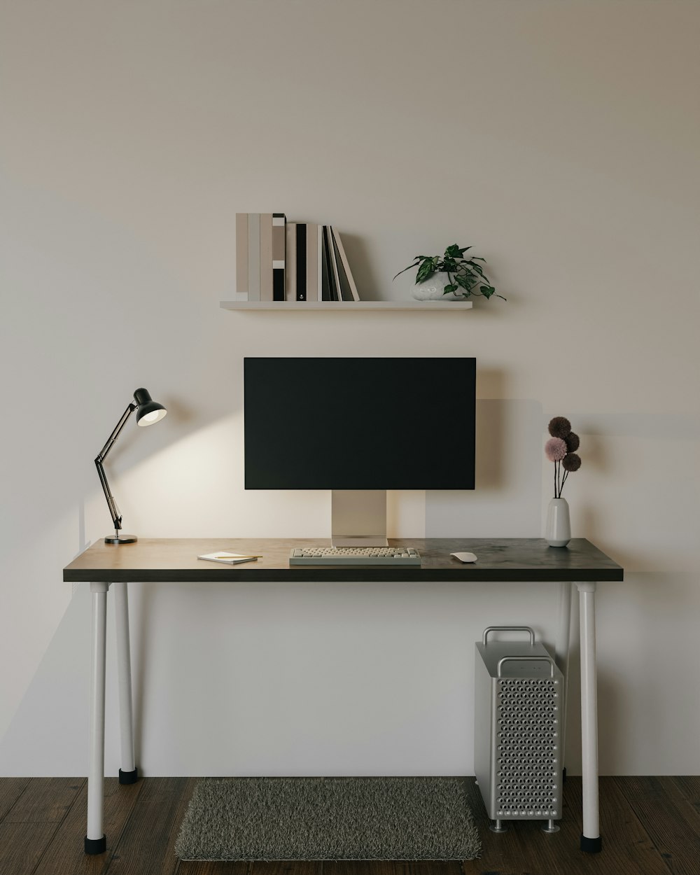 a computer desk with a monitor and a lamp