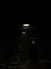 A warm, inviting room set up for a small group workshop with soft lighting.