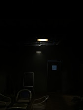 A warm, welcoming therapy room with soft lighting and comfortable chairs arranged for a group session.