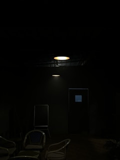 A calm therapy room with soft lighting and comfortable chairs arranged in a circle.