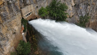 a large waterfall with water coming out of it