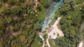 Drone view of a water resource management site with clear water and surrounding greenery