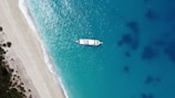 an aerial view of a boat in the water