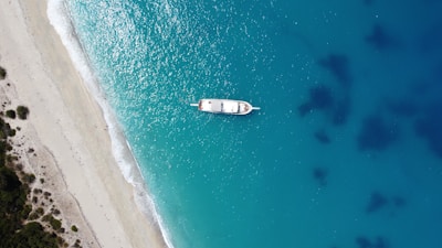 an aerial view of a boat in the water