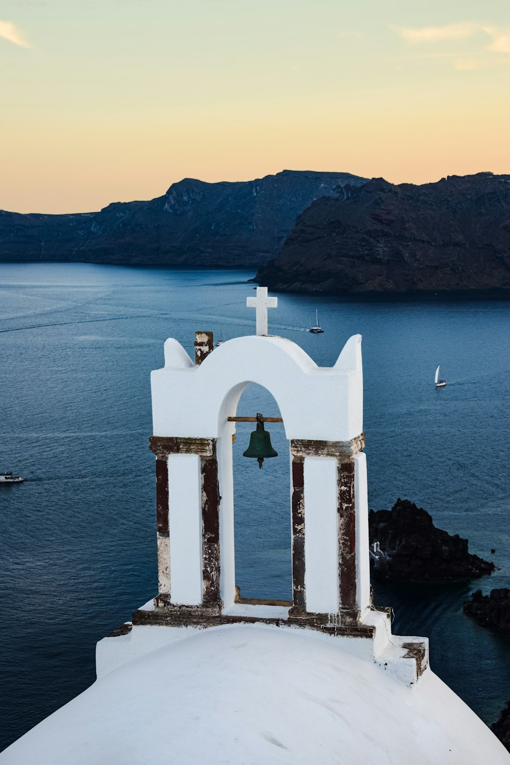 a bell tower with a bell on top of it