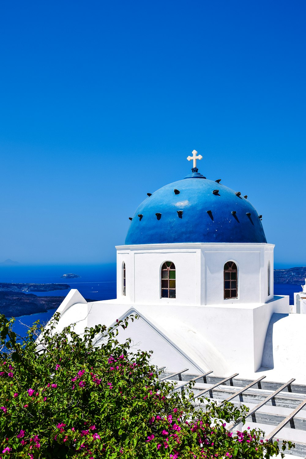 a blue dome with a cross on top of it