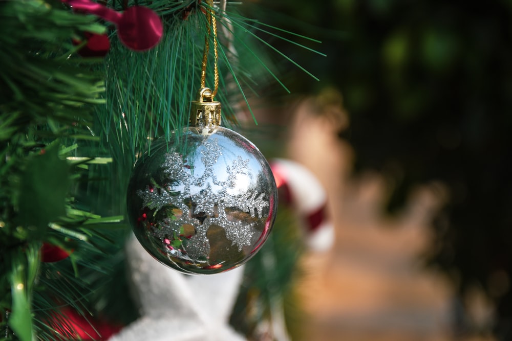 a christmas ornament hanging from a christmas tree