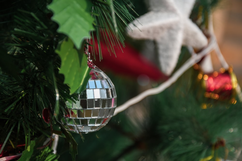 a christmas ornament hanging from a christmas tree