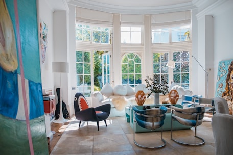 Bright living room with large windows and tasteful decor.