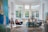 A bright and inviting living room with freshly painted walls and stylish decor.
