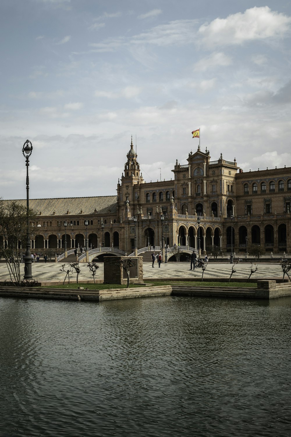 a large building sitting next to a body of water