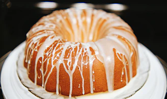a bundt cake with icing on a plate
