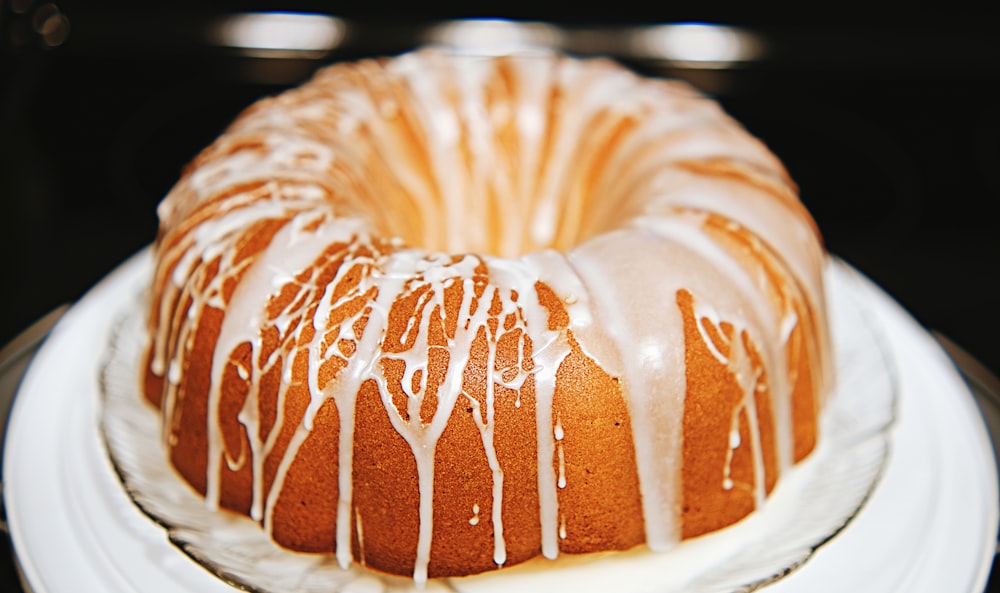 a bundt cake with icing on a plate