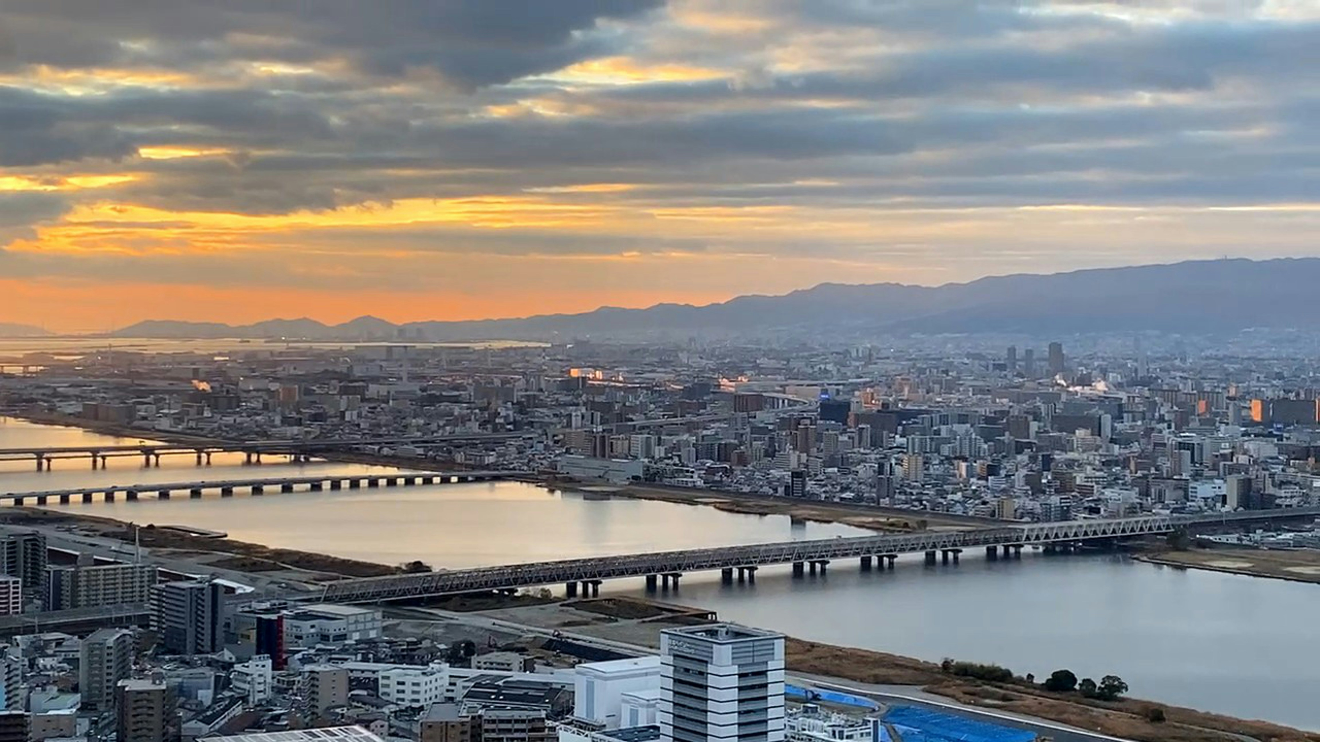a view of a city with a bridge in the background