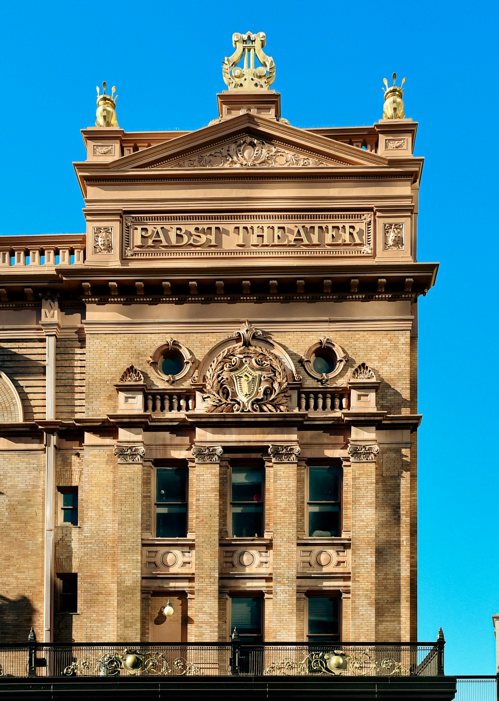 a tall building with a clock on the top of it