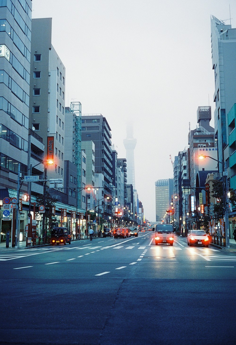 a city street filled with lots of tall buildings