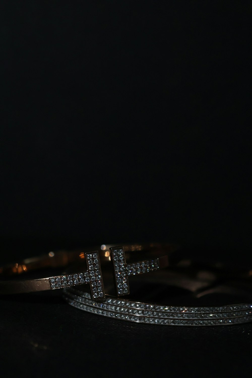 a close up of two bracelets on a table