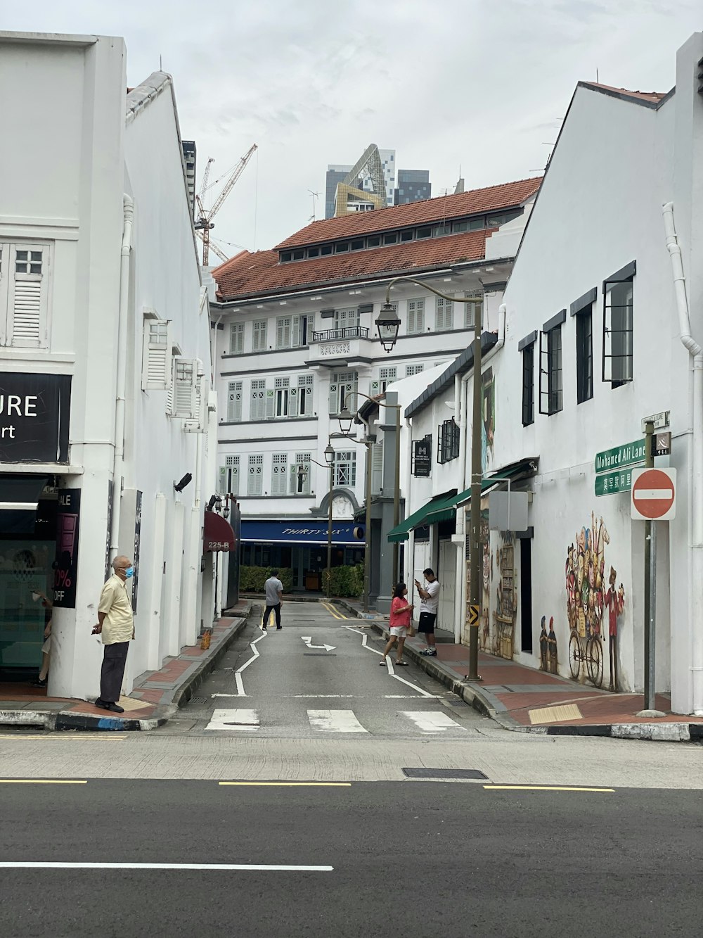 a street scene with a person crossing the street