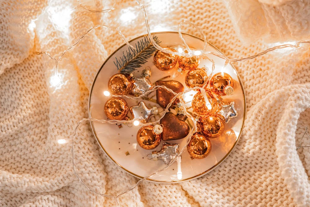 a white plate topped with lots of christmas ornaments