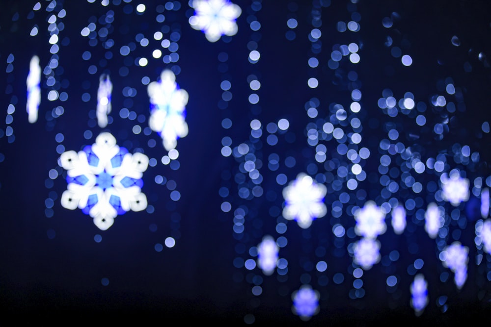 a blurry photo of snowflakes on a dark background