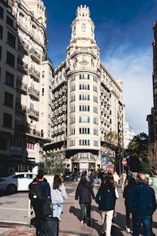 A vibrant cityscape of Buenos Aires with people walking toward a brighter future.