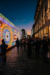 Photograph of an urban art installation blending with a vacant city space at dusk.