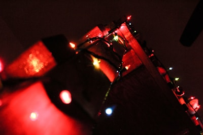 Colorful Christmas string lights draped over a festive mantel.