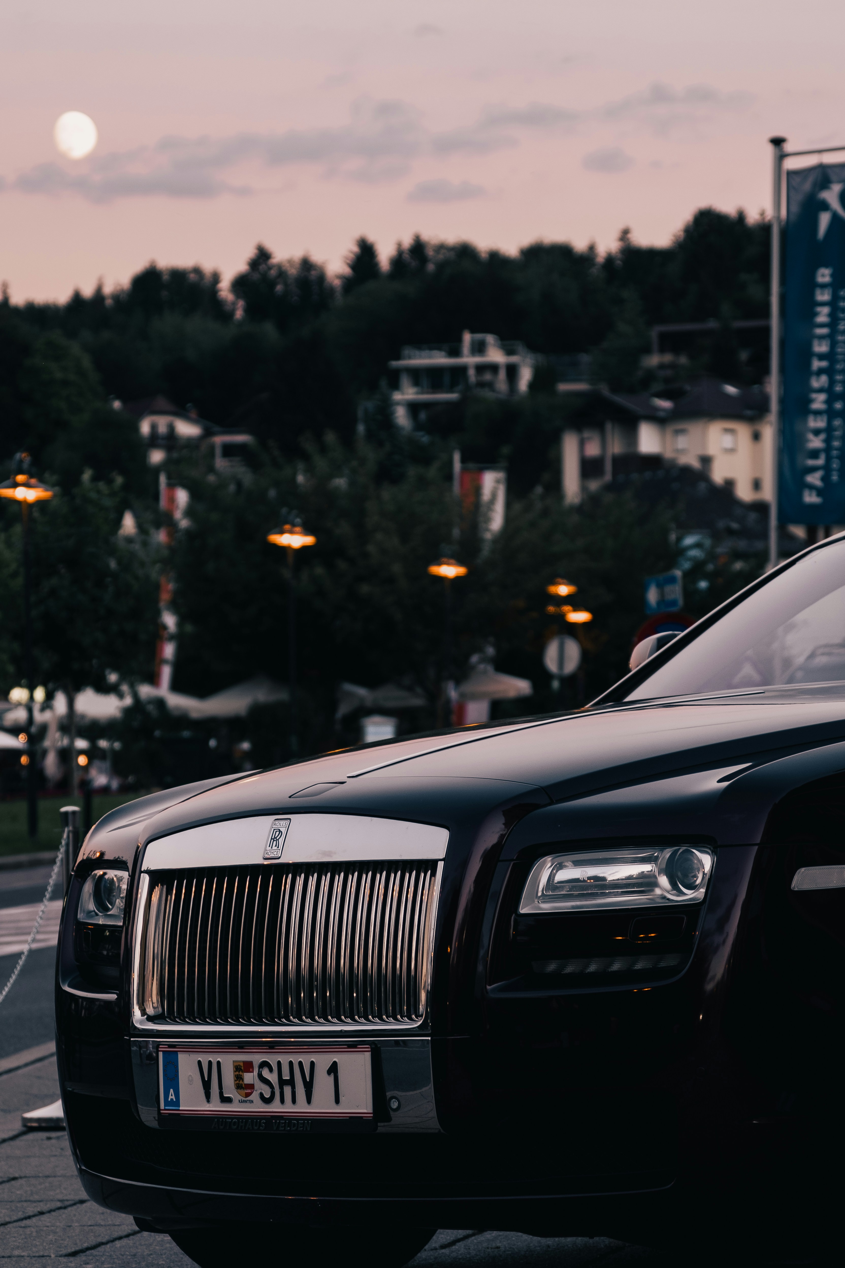 a black car parked on the side of the road