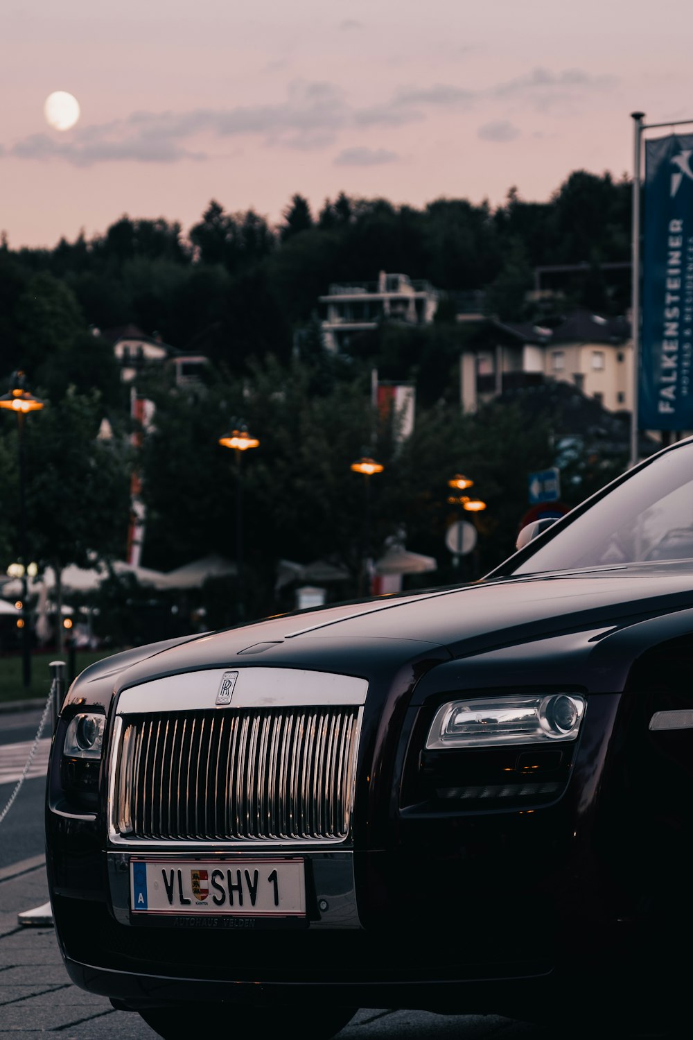 a black car parked on the side of the road