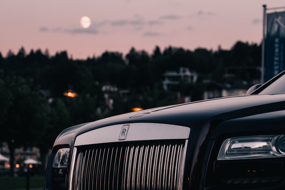 a black car parked in front of a building