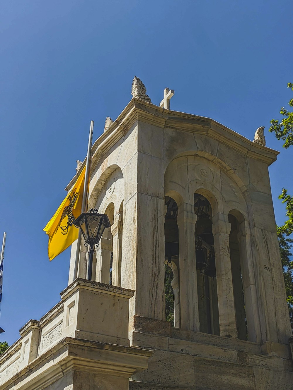 a tall building with a flag on top of it