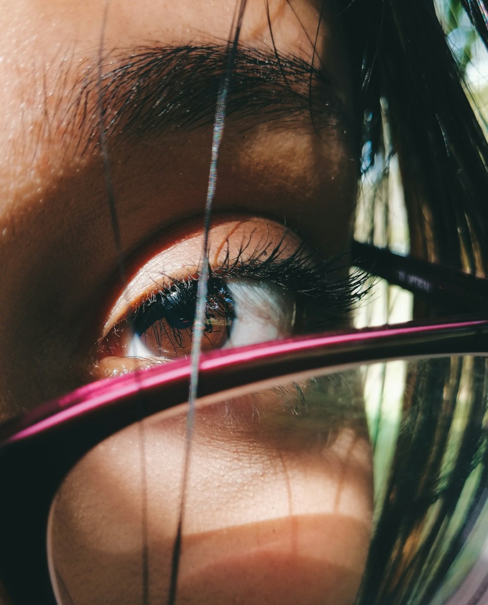 a close up of a person's eye with long eyelashes