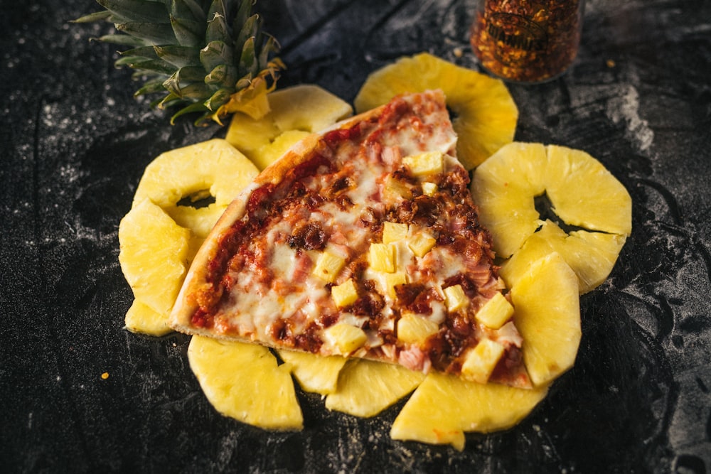 a piece of pizza with pineapple on top of it