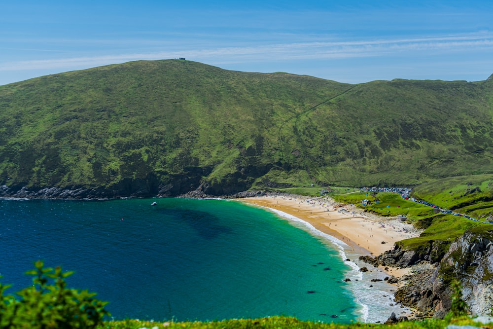 a view of a beach with a mountain in the background