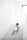 A young child in a diaper is crawling up a set of white stairs. The environment is minimalistic, with bright natural light coming from a window at the top right corner.