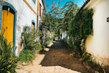Colorful colonial streets of Arequipa with locals walking and vibrant flowers.