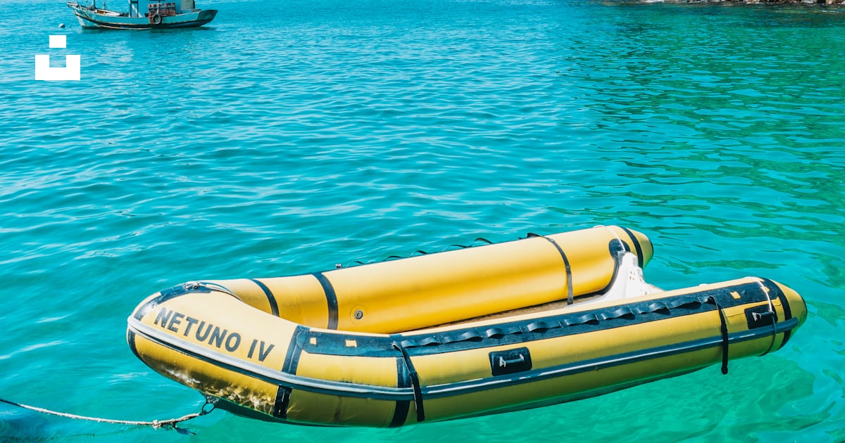 A yellow raft floating on top of a body of water photo – Free Summer ...