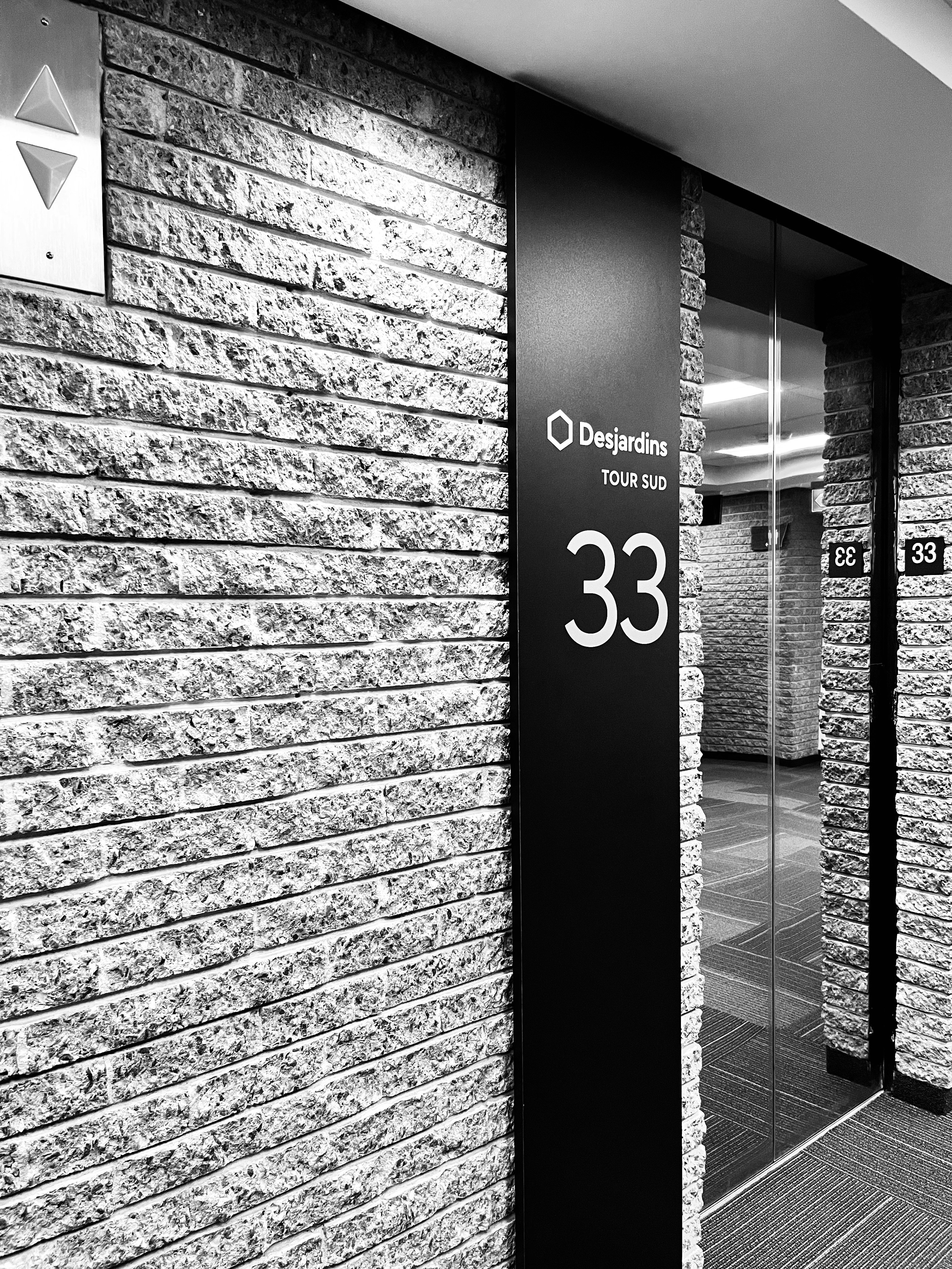 a black and white photo of a building entrance