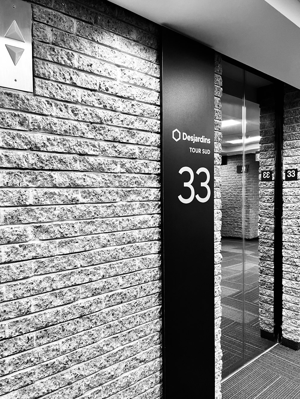 a black and white photo of a building entrance
