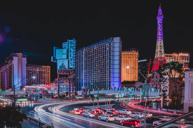 Las Vegas Strip at night with traffic and neon lights