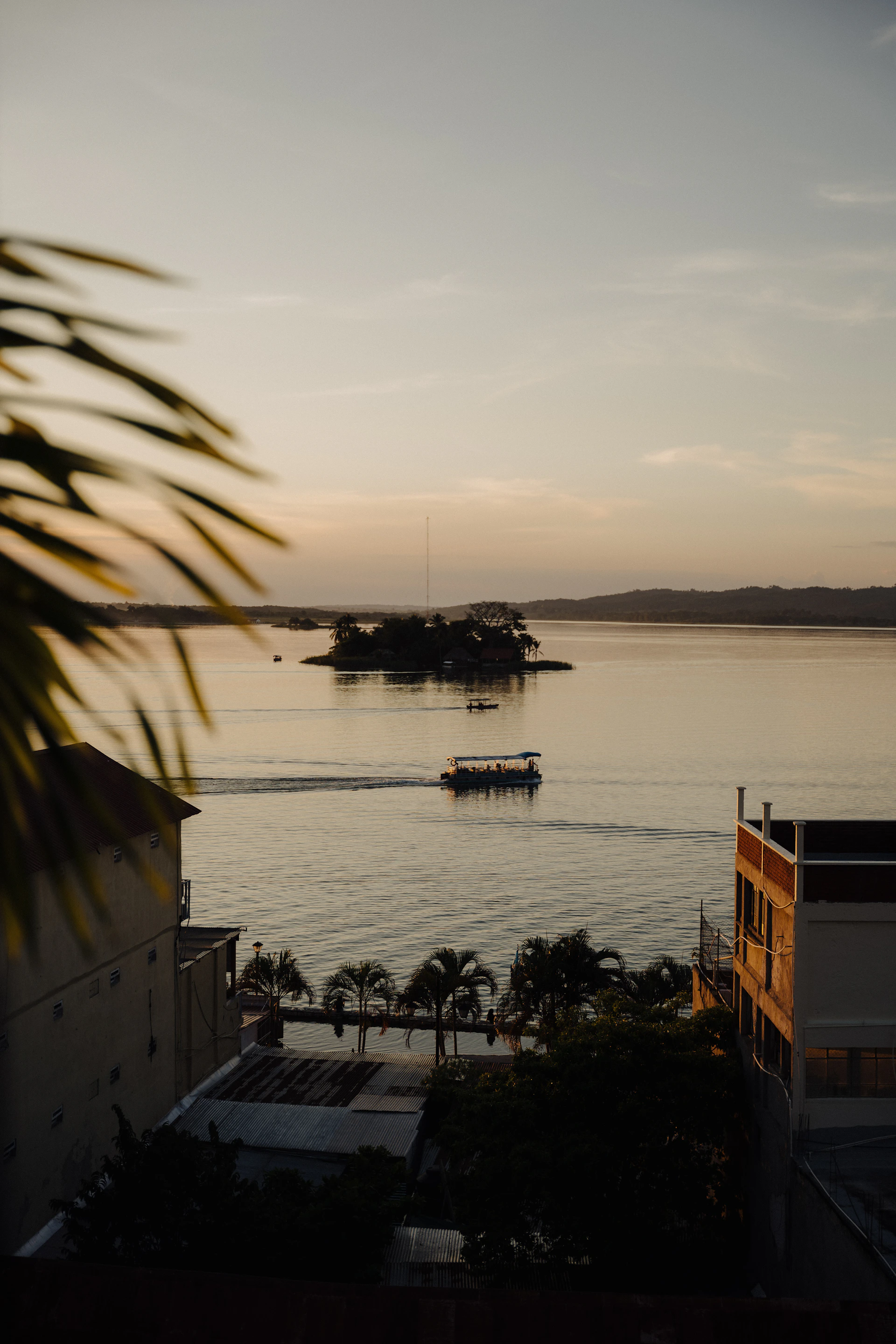 a body of water with a boat in the distance