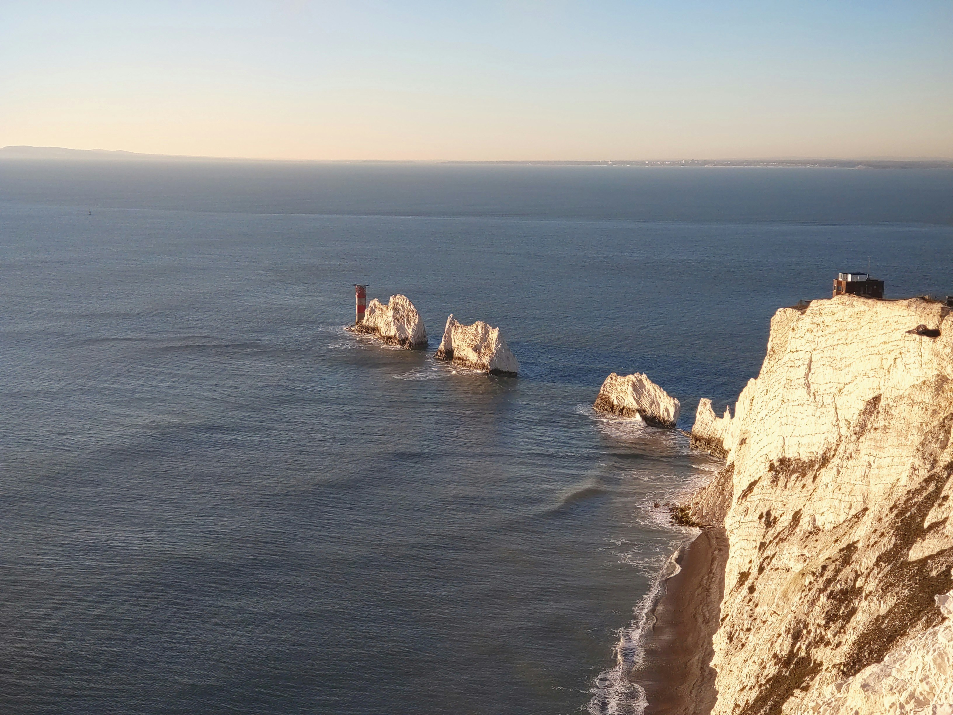 a view of the ocean from the top of a cliff