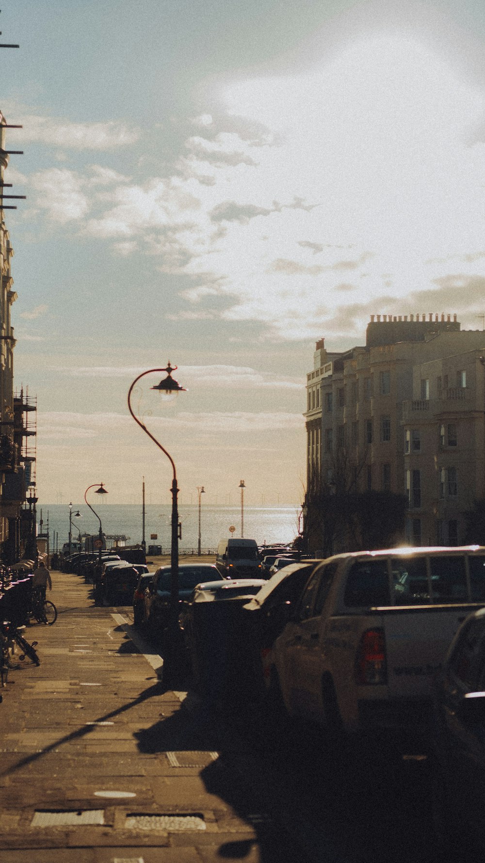 a street with cars parked on the side of it