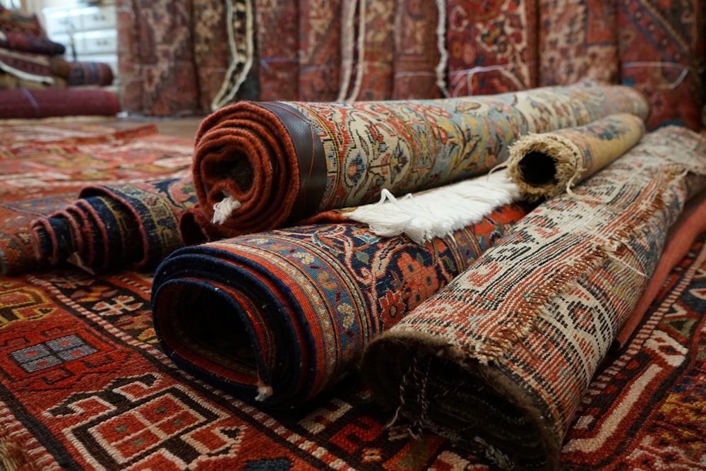 a pile of rugs laying on top of each other