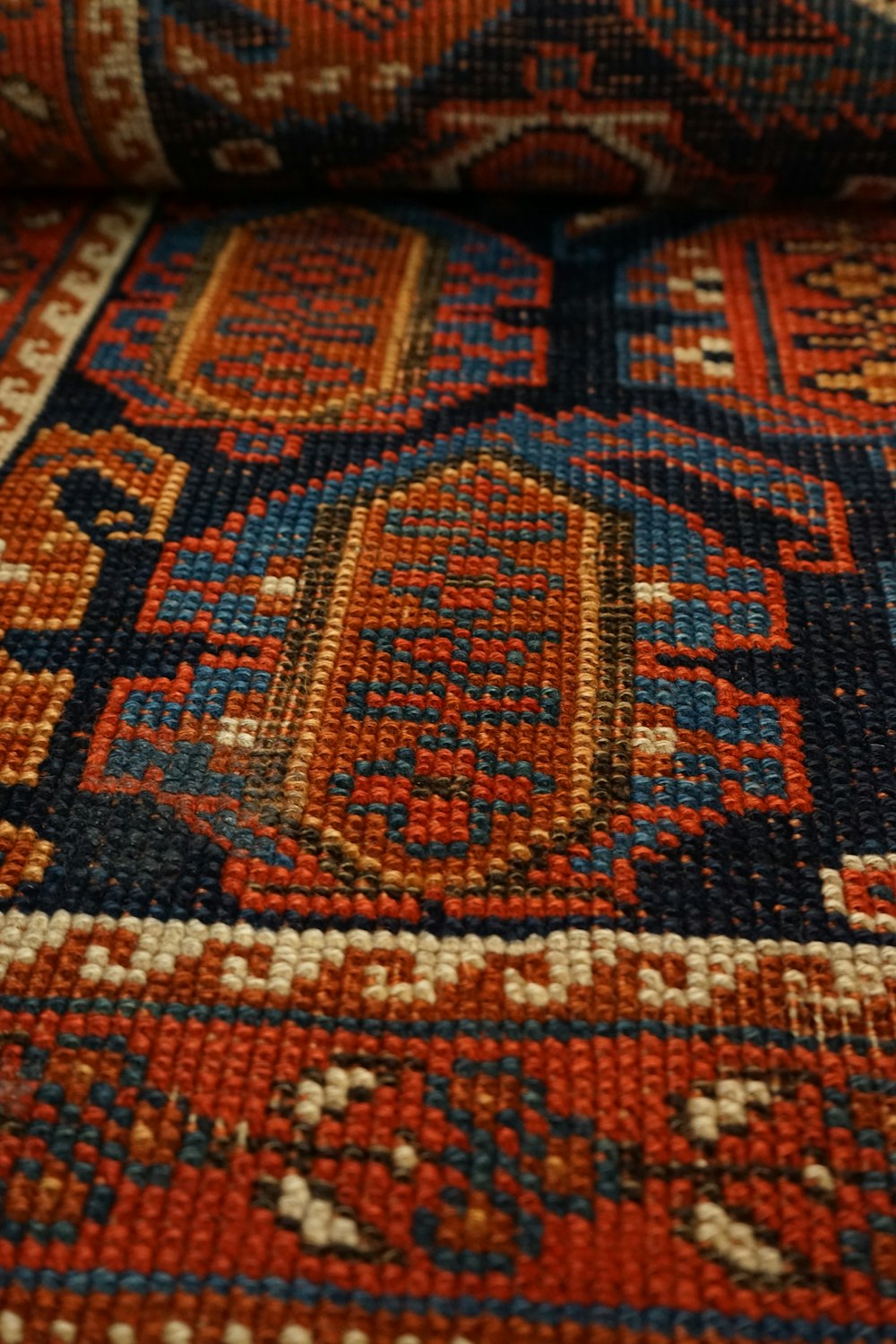 a close up of a multi colored rug