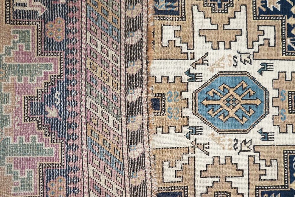 a close up of a rug with different colors