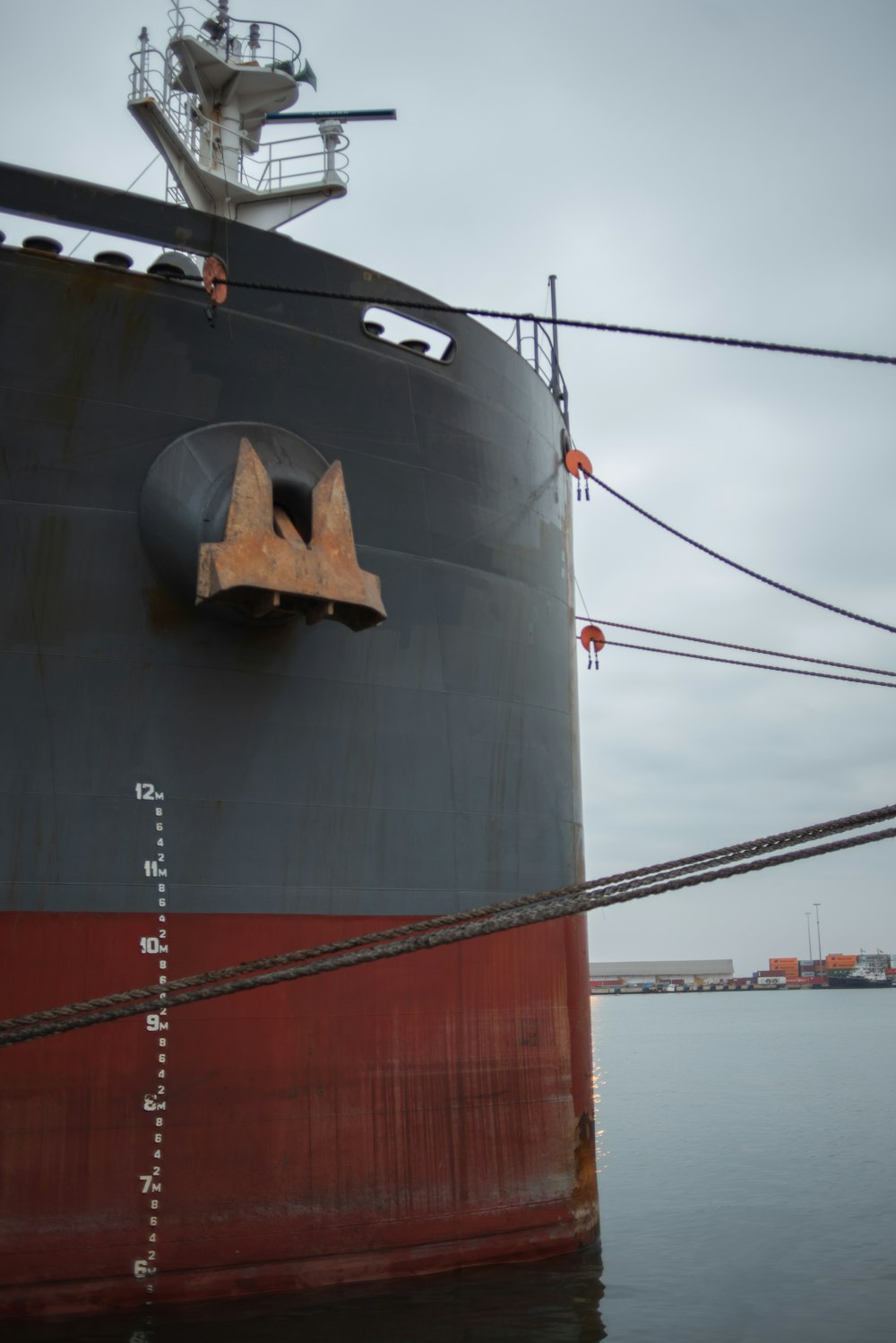 a large ship docked at a dock in the water