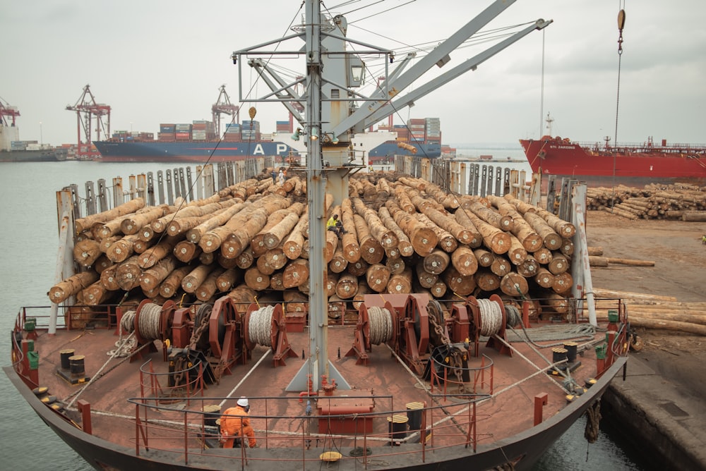 a large boat filled with lots of logs